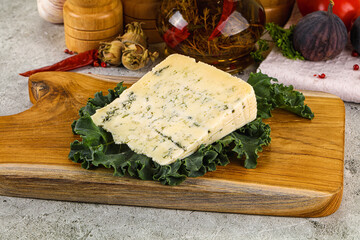 Blue cheese piece over board