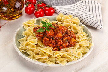 Italian pasta Farfalle Bolognese with meat