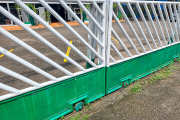 Newly painted white and blue iron fence