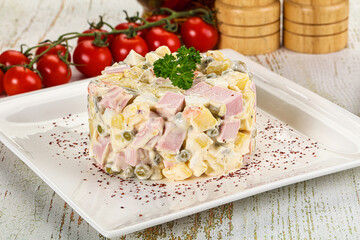 Russian traditional Olivier salad with sausages