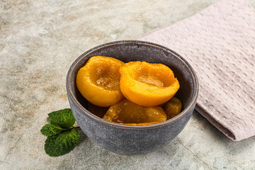 Canned marinated peach in syrop