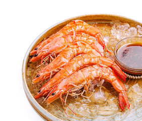 Freshly cooked shrimp served over ice with dipping sauce