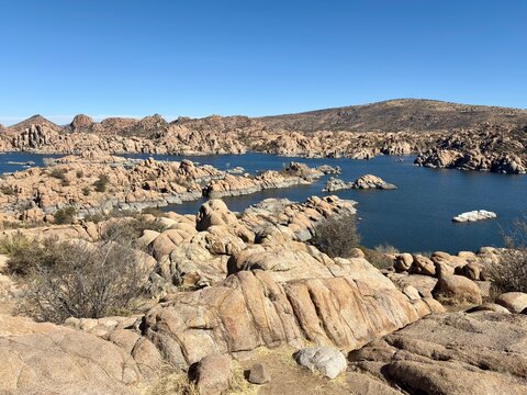 Scenic view of Watson Lake with rugged rock formations,  calm waters