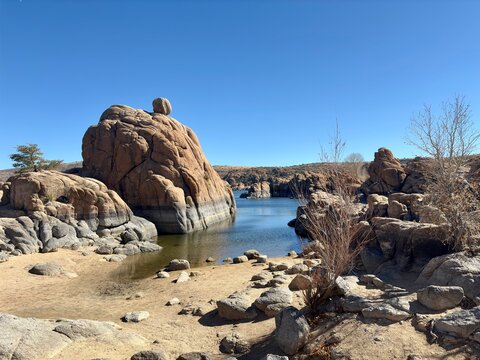 Scenic rocky shoreline of Watson Lake in Prescott, AZ, under clear sky