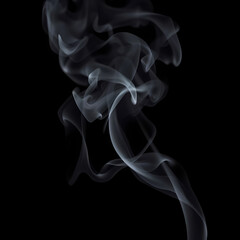 Wisps of curling gray smoke rising against a solid black backdrop &ndash; Mechones de humo gris ondulante elev&aacute;ndose sobre fondo negro uniforme