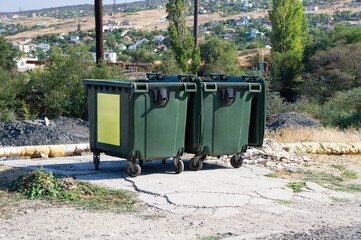 Garbage Containers Placed Along a Street in the Urban Environment
