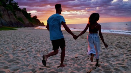Sunset Run: A couple enjoys a romantic run along the shoreline during a vibrant sunset, embodying the magic of connection and the beauty of shared moments. - Powered by Adobe