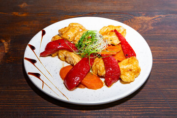 Delicious dish featuring chicken and vegetables on a white plate