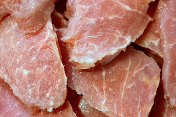 Slices of fresh meat ready for preparation at the market