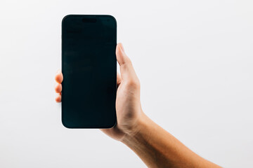 Man hand holding black smartphone mockup blank screen display, A hand holding a black cell phone isolated on white background, web site design application