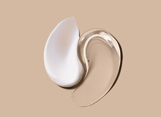 creamy texture of cosmetic samples on a pastel beige background