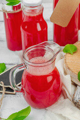Homemade watermelon kombucha. Healthy probiotic drink, kvass with basil leaves. Fermented beverage