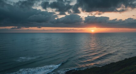 Fototapeta premium Tranquil Sea Landscape at Sunset with Dramatic Clouds and Gentle Waves Reflecting Glowing Horizon Over Calm Waters