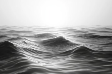 Obraz premium Calm waves glisten under soft sunlight above the ocean surface at dawn