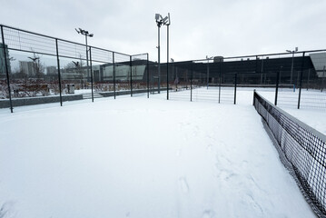 Obraz premium winter padel tennis court full of snow