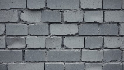 Obraz premium Gray cinder block wall texture with imperfections and subtle noise creating a rustic and industrial aesthetic for background use.