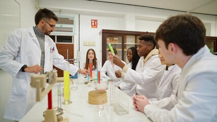 Chemistry teacher guiding students during experiment in laboratory - Powered by Adobe