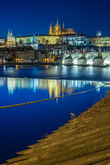 Panoramic night view of the iconic Charles Bridge over Vltava river and Prague Old town cityscape, in Prague, Czech Republic