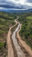 River valley road, winding stream, hilly landscape.