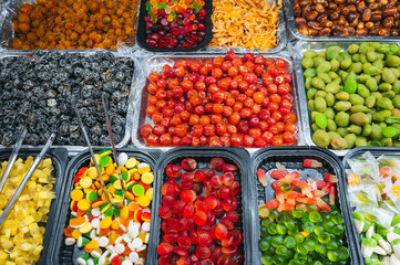 assortment of dried fruits, sweets, candies and chewable marmalade on the Asian market in Asia