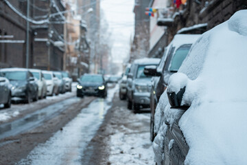 Fototapeta premium Snowmelt in the City – Drainage and Traffic Regulation Problems