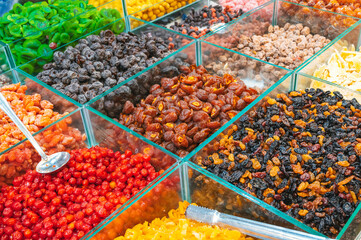 assortment of dried fruits and sweets on East Asian market in Asia