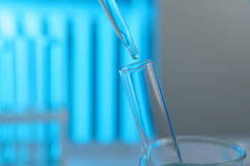 Dripping liquid into test tube on blurred background, closeup