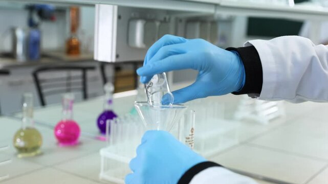 A chemical experiment is being conducted with reagent reactions and heating on glass.