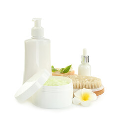 Different body care products and flowers isolated on white