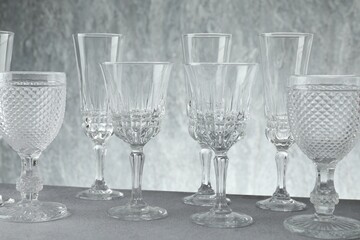 Many empty clean glasses on grey table