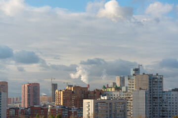 City beautiful landscape - panoramic view of residential multi-storey modern buildings among autumn trees on a sunny October day in the west of Moscow. High quality photo