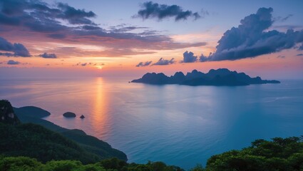 Stunning twilight landscape view from island viewpoint featuring vibrant sunset and serene ocean reflections with dramatic cloud formations.
