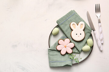 Beautiful table setting with sweet cookies, Easter eggs and gypsophila flowers on white background