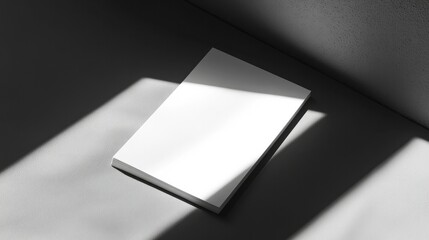 Notepad mockup with a soft shadow effect, placed on a monochrome background for a stylish stationery concept