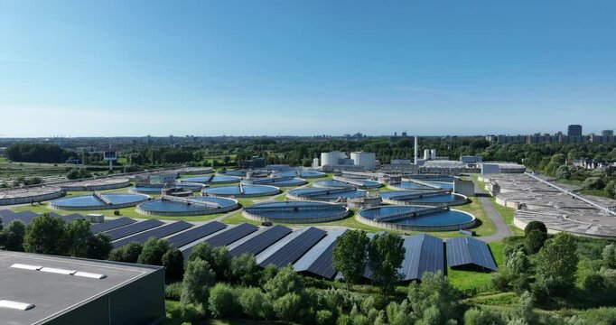 Large scale waste water treatment plant. removes and eliminates contaminants from wastewater. Aerial drone view.