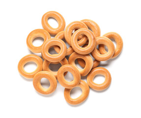 Heap of tasty bagels on white background