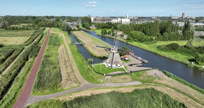 The Schaapweimolen also Schaapsweimolen polder mill of the ground-sailer type in the Dutch town of Rijswijk South Holland . The Netherlands. Aerial drone view.
