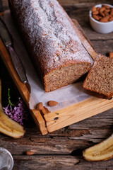 Almond banana bread. Powdered sugar, lilac, pie pieces.