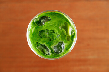 Iced matcha latte, authentic japanese matcha latte drink in a glass.