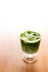 Iced matcha latte, authentic japanese matcha latte drink in a glass.
