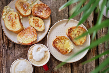 French toast with cheese. Top view, wooden background	
