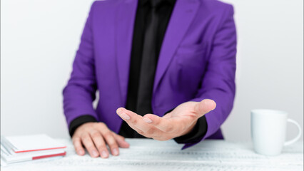 Businessman in Purple jacket Holding Important Message In One Hand. Man In Suit Showing New Crutial Idea In Palm. Executive Presenting Updated Critical Information.