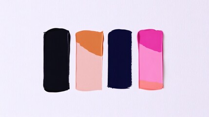 Colorful paint swatches arranged neatly on a white surface showcasing various shades and textures