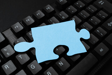 Colored sticker lying on black keyboard. Important information written over paper. Image with...