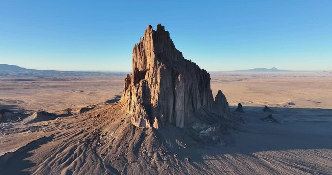 An unworldly, high-flying orbital aerial shot of the sacred &ldquo;Ship Rock&rdquo;, a massive, monolithic monadnock, towering above the high desert plain of the Navajo Nation, in New Mexico, United States.
