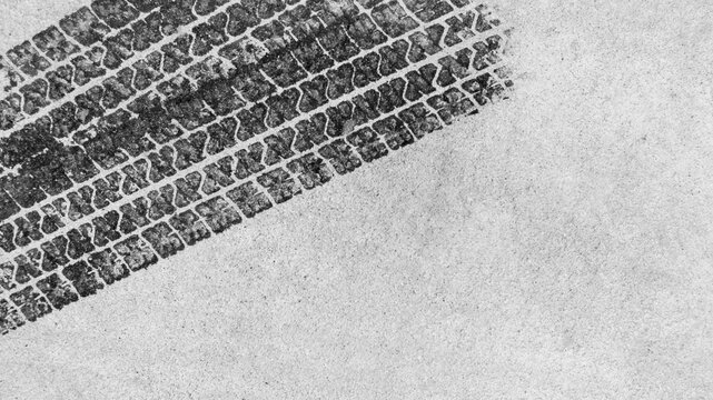 Black tire marks on road, Black rubber tire marks and tread marks, Tire trace track wheels texture and background, Auto tire tread grunge, Car wheel tyre tread track black tyre print, Top view.
