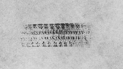 Black tire marks on road, Black rubber tire marks and tread marks, Tire trace track wheels texture and background, Auto tire tread grunge, Car tire wheel tyre tread track black tyre print, Top view.