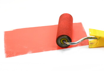 Obraz premium Painting a rough wall with roller. Paint roller leaving stroke of red color over a white background. usable for text and messages.