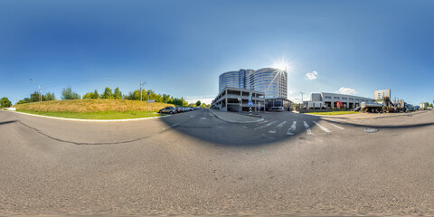 hdri 360 panorama on road near modern business office building  with multi-level parking in...
