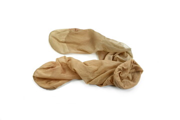 Women's used nylon tights pantyhose beige color on isolated white background.